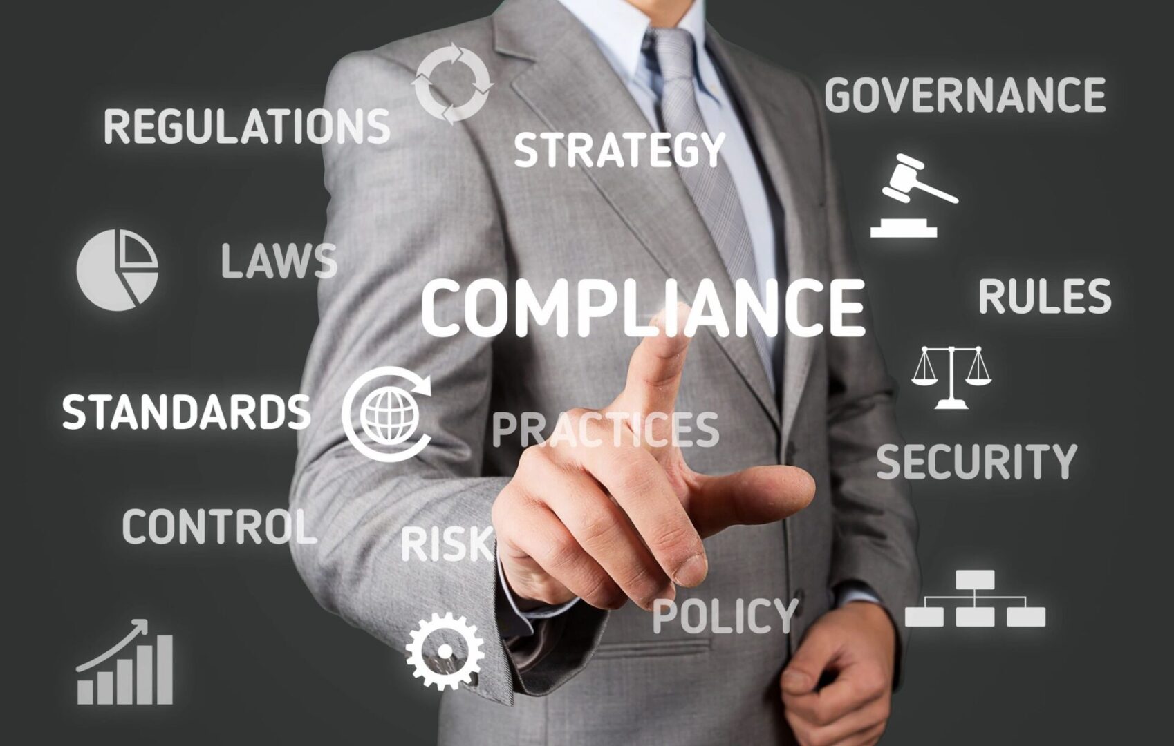 fm=f_2957 A man in a suit pointing to the word compliance.