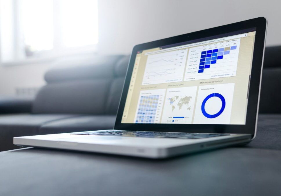 Laptop displaying charts and graphs.